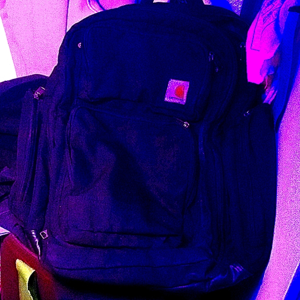 Lightly used heavy duty carhartt multi pocket work backpack